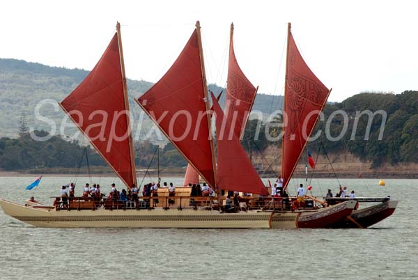 HINE MOANA & UTO NI YALO - Polynesian vaka (voyaging canoes), Auckland, New Zealand.
--------------

Anyone gazing across Auckland's Waitemata Harbour today could have been forgiven for thinking the next great wave of Polynesian migration had begun.

Four traditional ocean-going vaka, each carrying a crew of around 16, sailed around the Auckland's inner harbour, their skippers fine tuning their vessels in readiness for their departure on Wednesday 14th April (providing the weather gods are in benevolent mood) for an epic Pacific passage to French Polynesia, Cook Islands, Samoa, Tonga and Fiji.

The four vaka, seen here with the classic 1898-built Arch Logan gaff cutter RAINBOW (A7) off Ngataringa Bay near the Auckland Harbour Bridge, were constructed at the Salthouse boatyard in Greenhithe, Auckland and utilise modern construction techniques and technology (two of the vessels use solar energy to power auxilliary propulsion systems) as well as traditional rope lashings. The hulls are made of E-glass and foam.

The idea for today's regatta and upcoming Pacific voyages are the brainchild of German philanthropic organisation Okeanos, a group dedicated to highlighting the environmental pressures and threats affecting the world's oceans.

The upcoming ocean voyage is aimed at re-establishing cultural links and highlighting key environmental issues affecting the island nations of the Pacific and their peoples. 

One vaka will remain behind at each of the destinations visited by the fleet, that vessel to be used for crew training. It will also be used for cultural and educational purposes.

The four vaka sailing in today's Te Kumete O Te Moana regatta were Te Matua a Maui (NZ crew) Hine Moana (Western Samoa, Vanuatu, Tongan crew), Uto Ni Yalo (Fijian crew)  and Maramaru Atua (Cook Island crew). A fifth vaka, Faafaite, will join the fleet en-route in Tahiti.

A much longer Pacific voyage will take place next year when Auckland will host a gathering of seven of these magnificent vessels prior to their departure for Hawaii via French Polynesia. 11 April 2010. Photo by SeapixOnline.com/Trevor Coppock